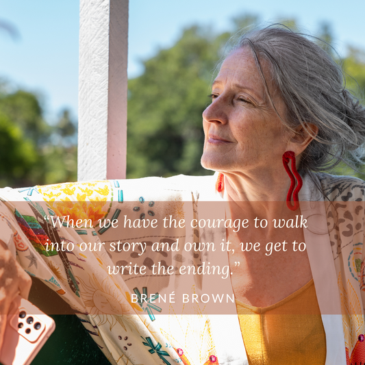 A photograph of a woman wearing a colorful top and interesting earrings. There is a quote from Brene Brown about owning your story at the bottom of the picture.
